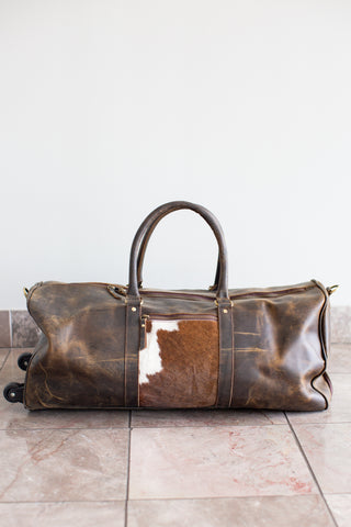 distressed brown  leather cowhide duffle bag with wheels