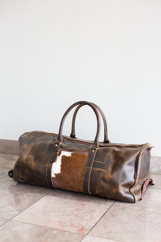 distressed brown  leather cowhide duffle bag with wheels