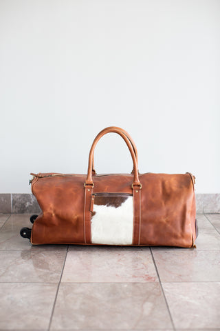 tan leather cowhide duffle bag with wheels\