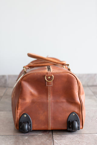 tan leather cowhide duffle bag with wheels\