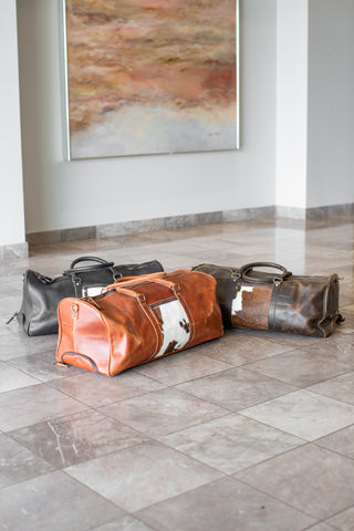 Leather & Cowhide Duffle Bag with Wheels.