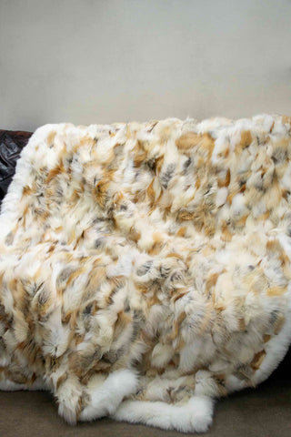 golden island and white fox fur blanket