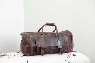 brown distressed leather duffle bag