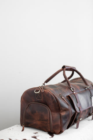 brown distressed leather duffle bag