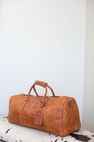 tan leather duffle bag