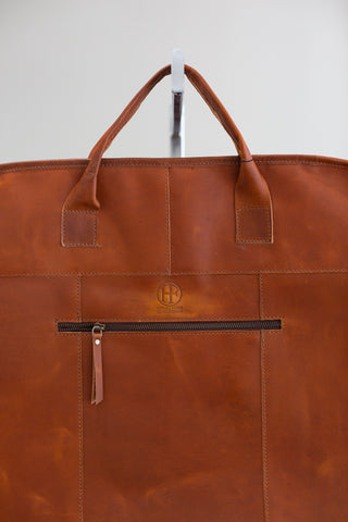 tan leather garment bag