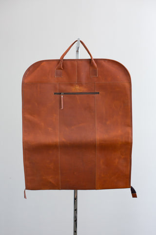 Tan leather garment bag