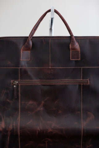 distressed brown leather garment bag