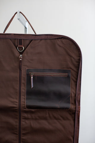 inside of brown distressed leather garment bag