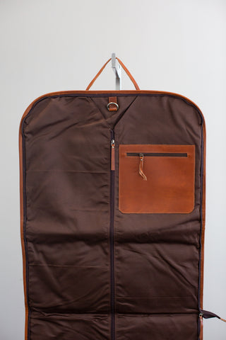 inside of tan leather garment bag