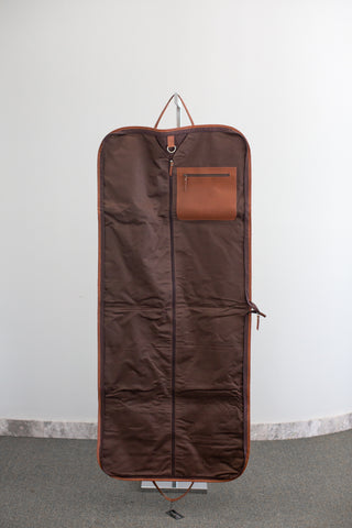 inside of tan and white cowhide leather garment bag